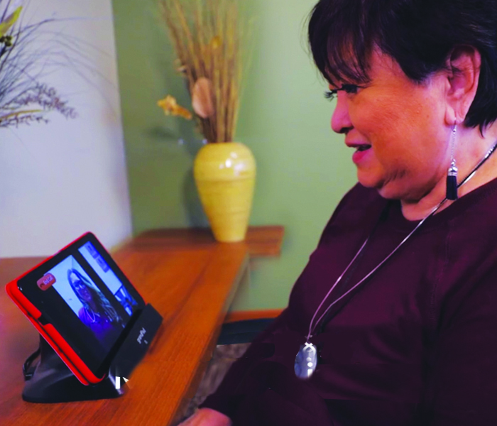 Lutheran Senior LIFE participant uses GrandPad tablet to connect with the LIFE care team.